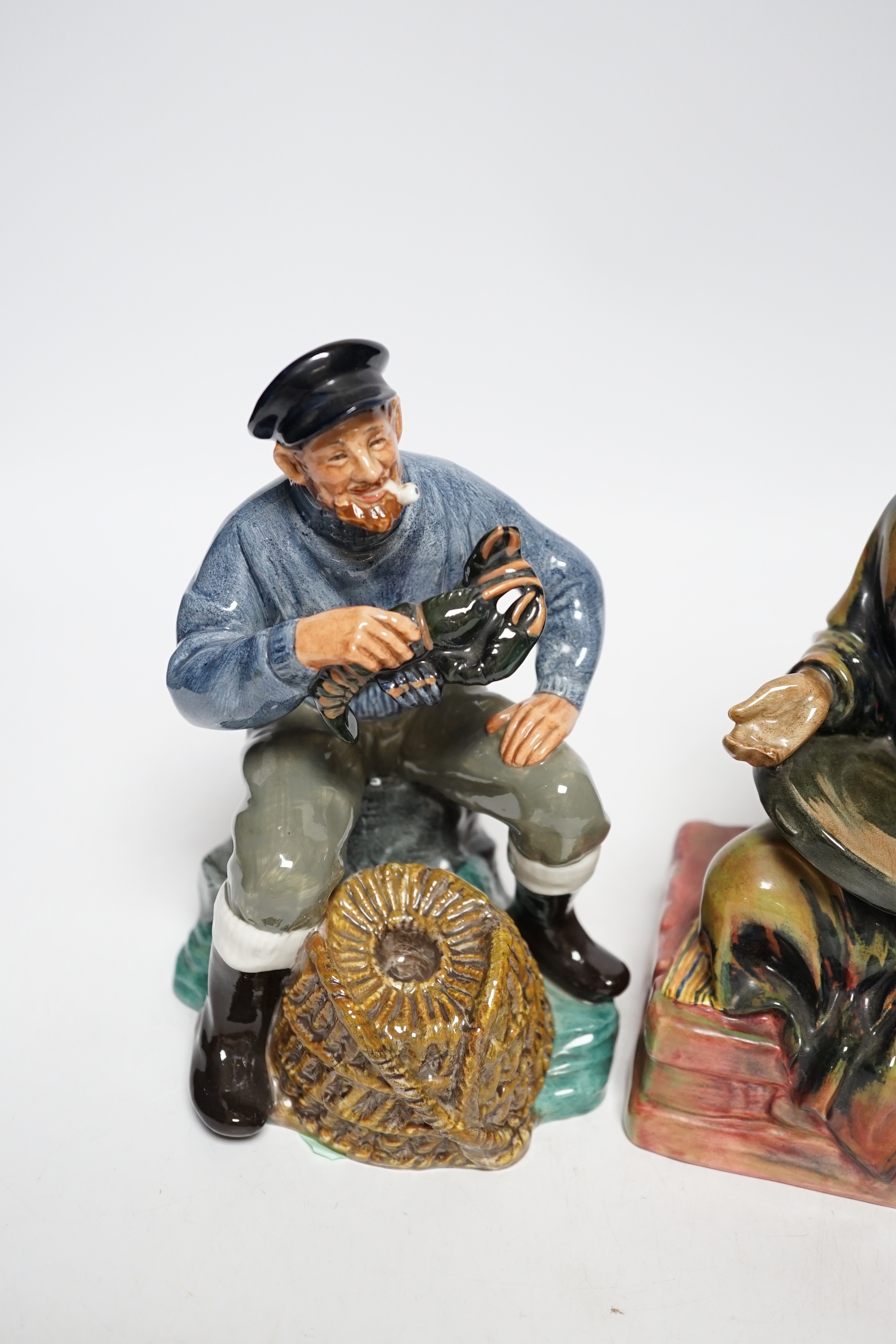 Two Doulton figures, Lobster Man and Mendicant